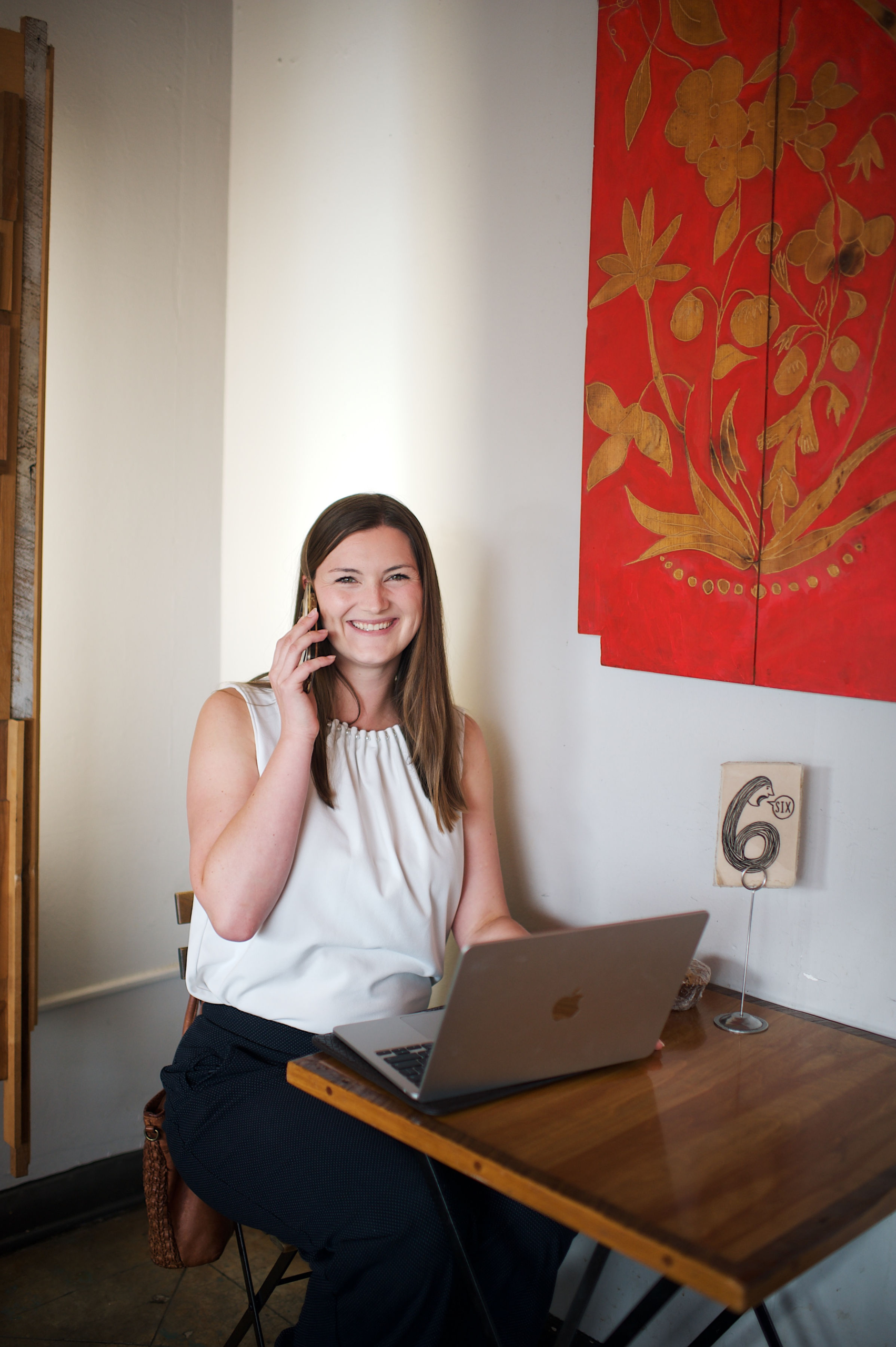 Sami Lamb in a professional office setting with warm lighting